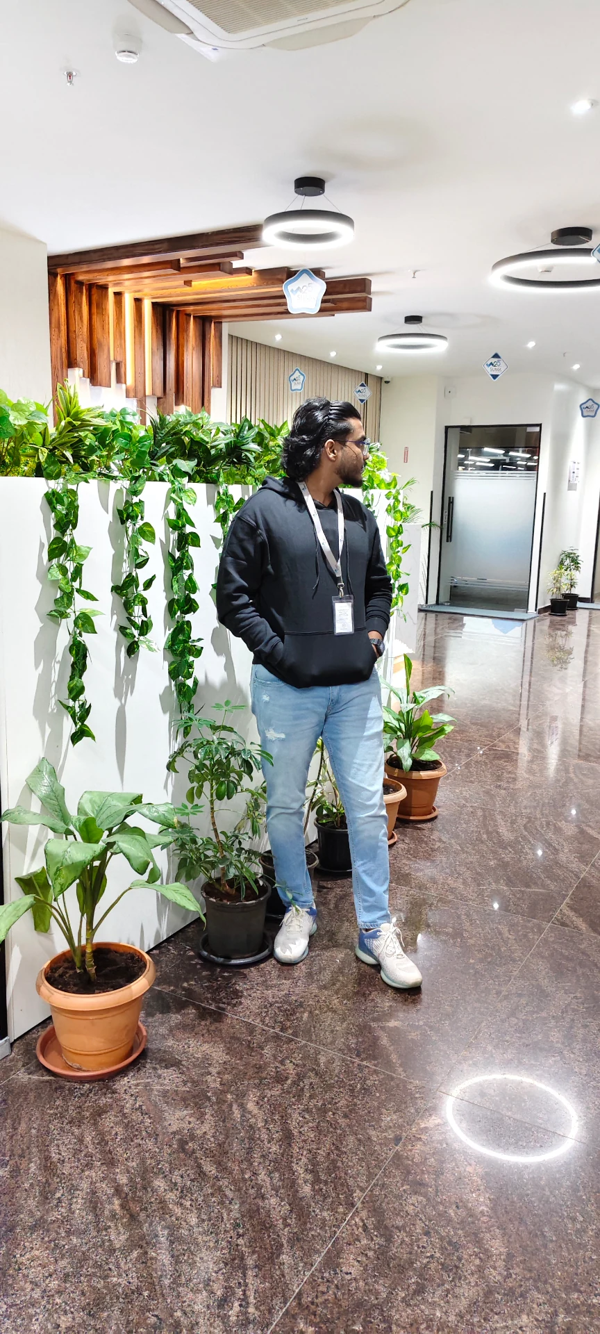 Mahendra Chiravande posing in a professional office setting